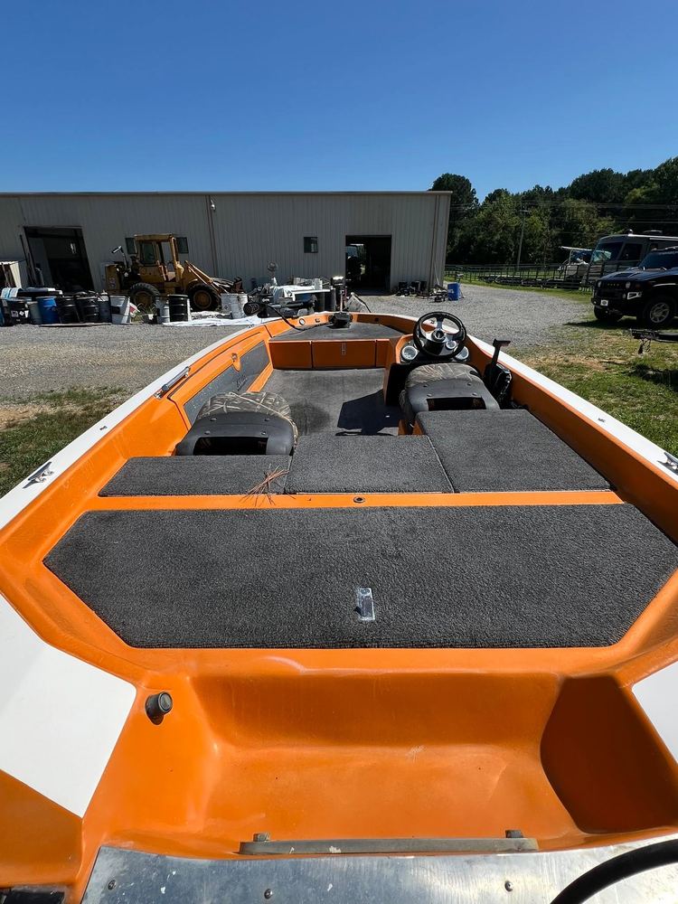 Orange and white bass boat deck after refinishing